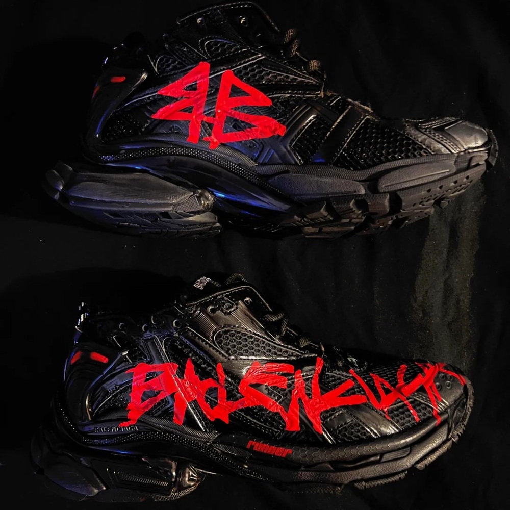 Red and black Balenciaga runners graffiti